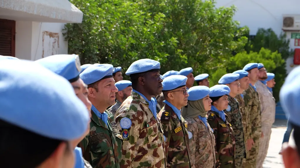 Photo: MINURSO UN soldiers stand in a row wearing blue berets