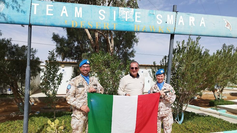 Soldiers holding Italian flag