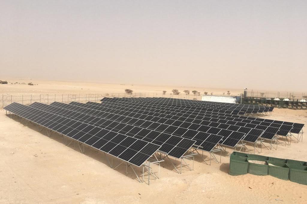 Rows of solar panels on a UN base in the desert