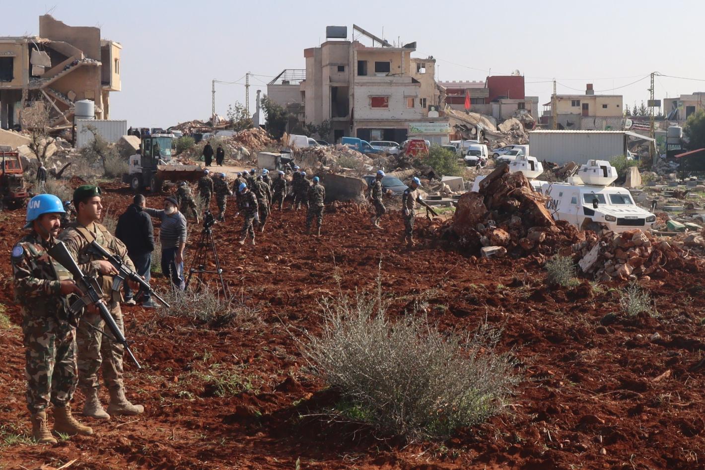 Peacekeepers assist Blida residents to prepare field for olive plantation Peacekeepers assist Blida residents to prepare field for olive plantation